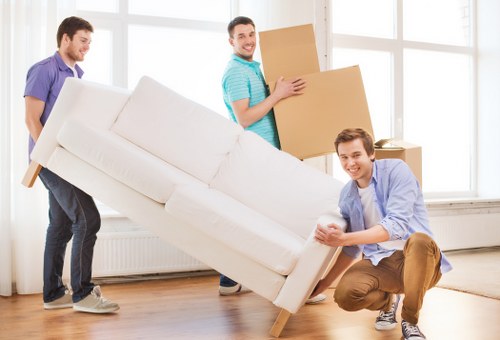 Professional movers packing household items for a relocation in Lissongrove