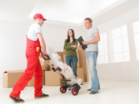 Team using safe lifting techniques during a move