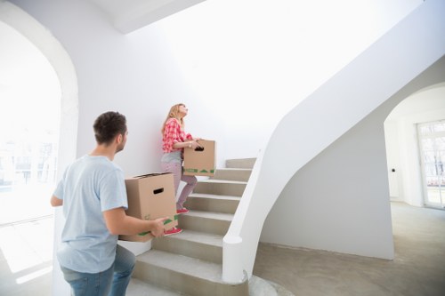 Local movers navigating a narrow Lisson Grove street with office furniture