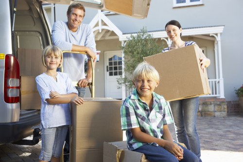 Boxes, furniture, and moving equipment prepared for a local house removal