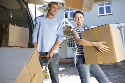 Worker assessing a load and securing items for transport