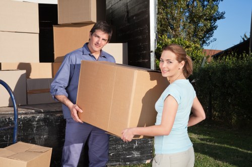 Local Lissongrove movers handling packed boxes and furniture