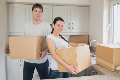 Professional movers loading items carefully into a van
