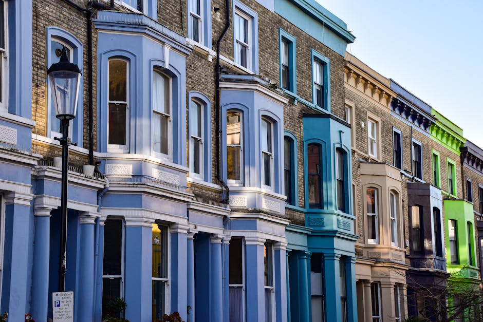 A photograph taken during daytime shows a street in Lisson Grove, Westminster, lined with elegant, white Victorian-style residential buildings featuring intricate architectural details, large sash win
